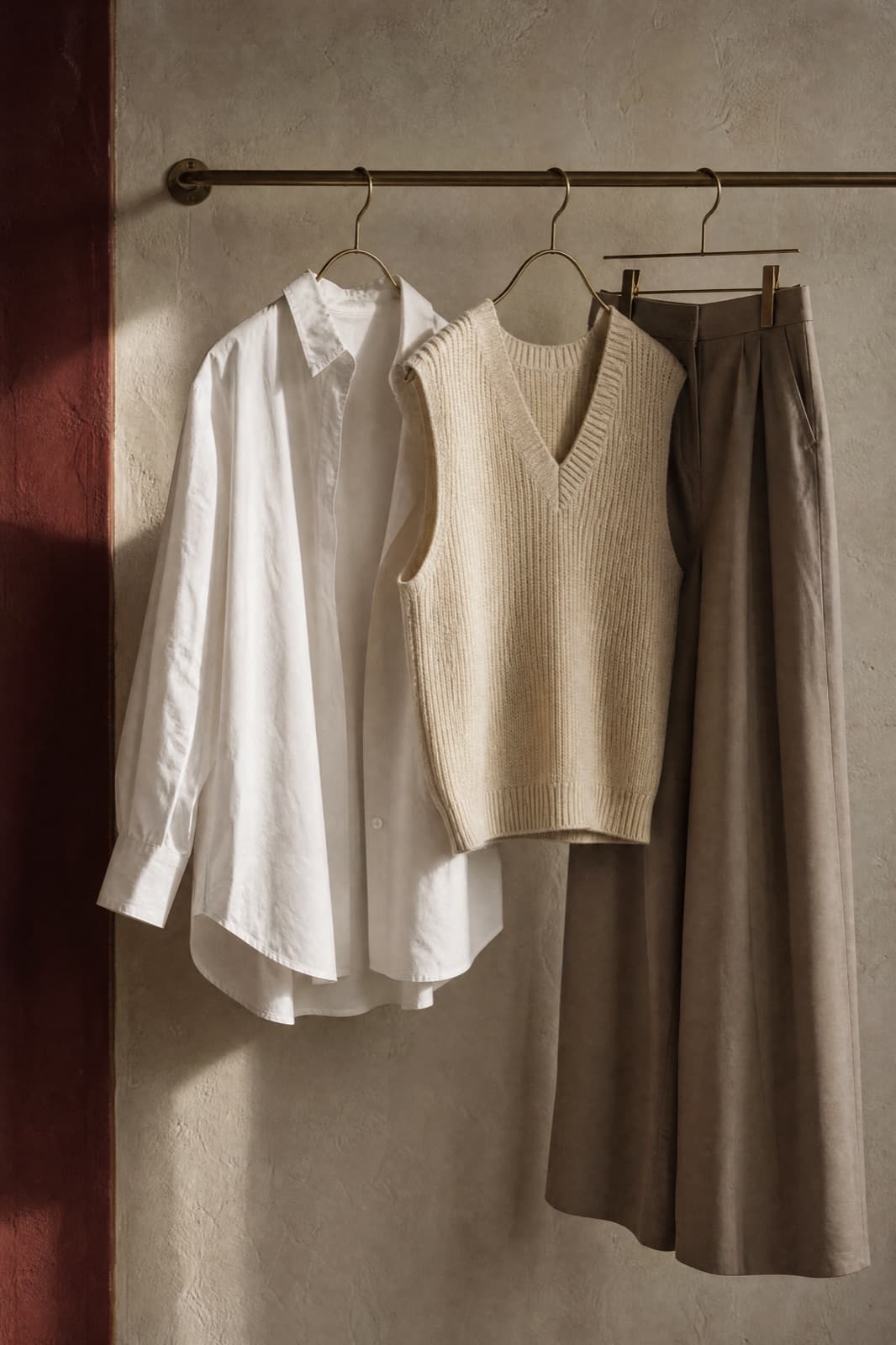 Layering Set, hung from a rail against limestone plaster.